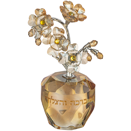 פרח מעוצב מזכוכית עם בסיס שקוף, מתאים כמתנה לבית חדש או לעיצוב מרגש.